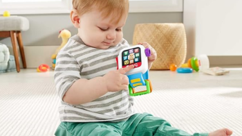 Fisher Price smartwatch toy for kids with lights, music, and interactive play buttons