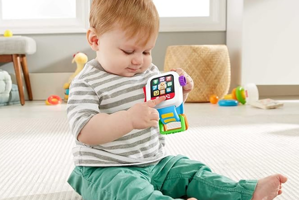 Fisher Price smartwatch toy for kids with lights, music, and interactive play buttons